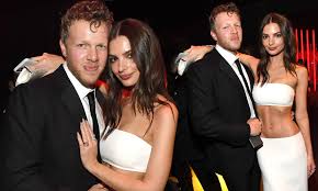 Now that the model's secret is out, she's done hiding her tummy. Emily Ratajkowski Cosies Up To Husband Sebastian Bear Mcclard At Vanity Fair S Oscars Bash Daily Mail Online