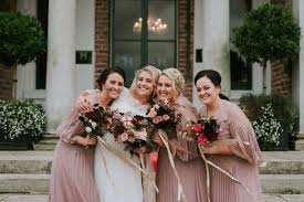 who pays for the bridesmaids dresses a
