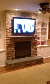 over fireplace tv installation stone