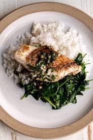pan seared white fish cooking with