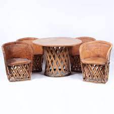 Lot - Mexican Equipale traditional leather patio furniture; 4 barrel chairs  and table set.
