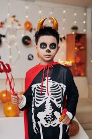 confident little boy dressed as devil