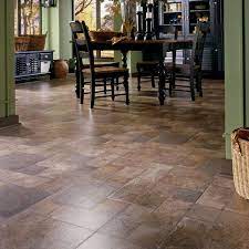 This flooring comes with an attached underlayment to reduce noise under foot. Beautiful Laminate Flooring Tuscan Stone Terra Kitchen Remodel Design Mediterranean Home Decor Kitchen Flooring