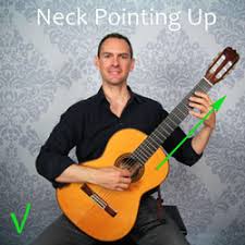 How to hold a guitar. How To Hold A Guitar Best Sitting Position For Guitar