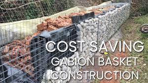Retaining wall with gabion baskets | Cost saving panel with cobbles and  recycled brick - Part 1 - YouTube