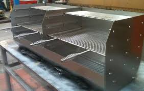 a brick bbq grill in stainless steel