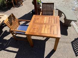 teak patio set table and 2 armchairs