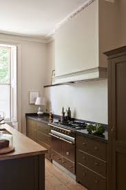 painted brown kitchen cabinets are