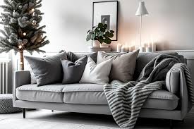 a cozy couch with three cushions and a