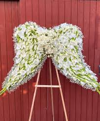 angel wings funeral flower arrangement