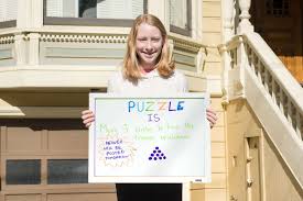 11 year old hangs a puzzle in her