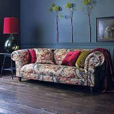 Floral / flower 3 piece gold and brown embossed fabric living room set (set of 3) by bloomsbury market. Living Room With Dark Blue Painted Walls And Raspberry Accent Colours Sofa Upholstered In Linwood Fabric Midnight Rambl Floral Sofa Floral Couch Printed Sofa