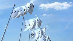 Развевающиеся Флаги С Логотипом Gucci На Фоне Неба, Редакционный  3D-рендеринг Фотография, картинки, изображения и сток-фотография без  роялти. Image 84306844