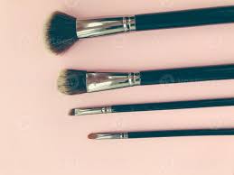 brushes on a pink background makeup