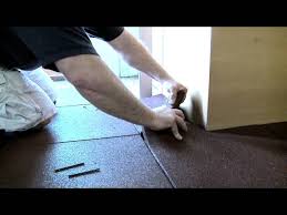 installing rubber gym flooring tiles