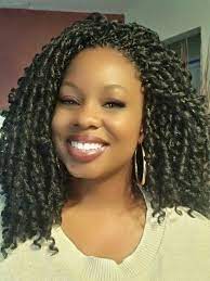 Half up half down dreadlocks hairstyle with messy bun and parted wavy bangs; 20 Crochet With Soft Dread Hair Ideas Soft Dreads Dread Hairstyles Natural Hair Styles