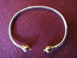 silver bracelet with two gold