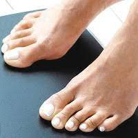 black spots on your legs and feet