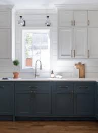 I cannot afford to replace the upper maple so they must stay in place. White Top Cabinets And Blue Bottom Cabinets Design Ideas
