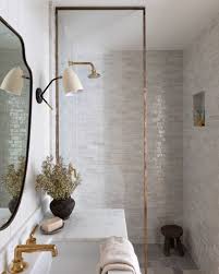 The geometric pattern breaks up the long, grey tiles across the floor of the bathroom to add texture and character. Create A Stylish Walk In Shower Easily Decoholic