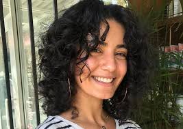 A style like this can help add volume towards the top of your head, while thinning out the lower length of your hair. Natural Short Curly Hair With Curtain Bangs Novocom Top