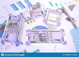 Indian 100 Rupee Notes On The Chart Paper And Pen Stock