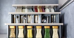 Inexpensive towel racks mounted on the inside of kitchen cabinet doors makes a great way to store cookie sheets and cutting boards for easy access. Genius Ways To Organize Your Kitchen Using Dollar Store Items Forkly