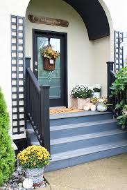 front porch fall decor clean and