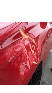 Preparing to remove the dent. Dent Craft Paintless Dent Removal Ltd