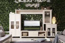 turned on tv on white wooden tv hutch