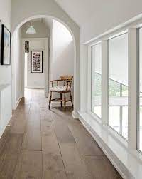 75 um tone wood floor hallway ideas