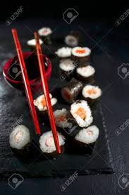 Presentation Of A Plate Of Sushi On A Black Slate Background