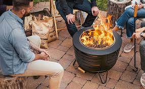 That is why wet firewood hisses and sizzles and is hard to burn while properly seasoned wood ignites and burns easily. Amazon Com Tiki Brand 25 Inch Stainless Steel Low Smoke Fire Pit Includes Free Wood Pack And Cloth Cover Garden Outdoor