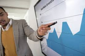 Businessman Pointing To Chart In Meeting D145_238_1123