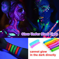 dark body face paint neon glow