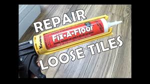 repair a loose tile fix a floor