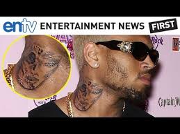 In our opinion, the face definitely looks like a woman, with the full lips, long lashes and high arching brows, and could possibly resemble rihanna. Chris Brown Rihanna And Justin Bieber All Get New Tattoos Entv Youtube