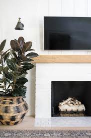 white painted brick fireplace with
