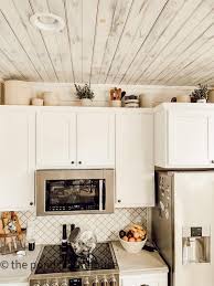 how to decorate above kitchen cabinets