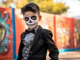 kid in day of the dead makeup with