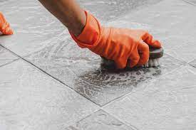 remove dried white cement from tiles