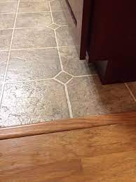 If you're remodeling and not installing pergo in a new installation, remove any carpet, padding and remnants from the floor. Install Tiles On Top Of Laminate Floor In Kitchen Home Improvement Stack Exchange