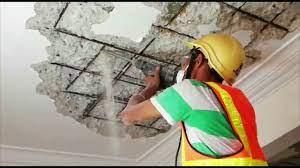 removing spalling concrete ceiling for