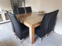 large square dining table with glass