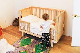 Mother Transitioning To Toddler Bed