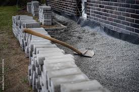 Laying Gray Concrete Paving Slabs In A