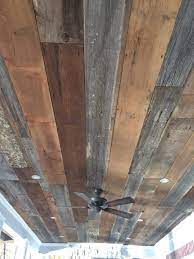 installed barn wood on our porch ceiling