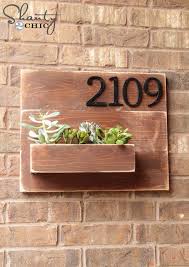 Use old or discounted cutting boards to create a unique living wall in your home. Diy Address Number Wall Planter Shanty 2 Chic
