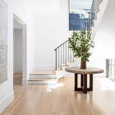 If the room is small and cozy or large and expansive, there are a few elements that help create an interesting lobby such as a foyer table. Round Table Under Staircase Design Ideas