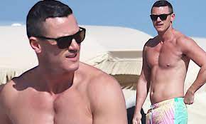 Luke Evans shows off his nipple piercings on holiday in Miami Beach 